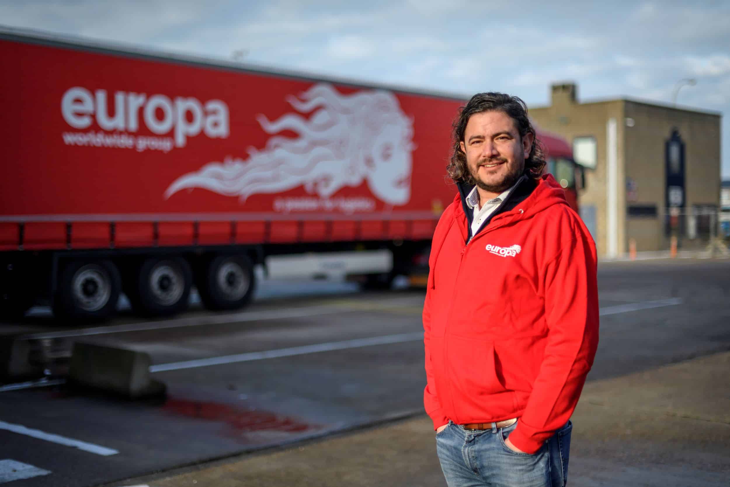 Carlo Turner stands in front of a Europa truck